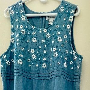 Ladies large sleeveless blue denim longer dress with white embroidered flowers,
